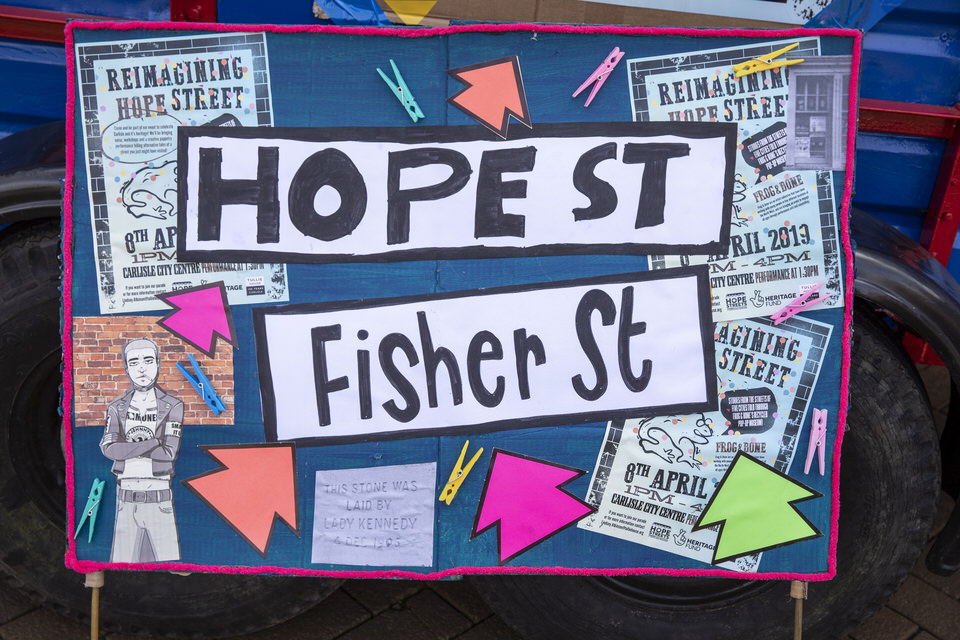 A handmade and decorated sign reads Hope Street and Fischer Street